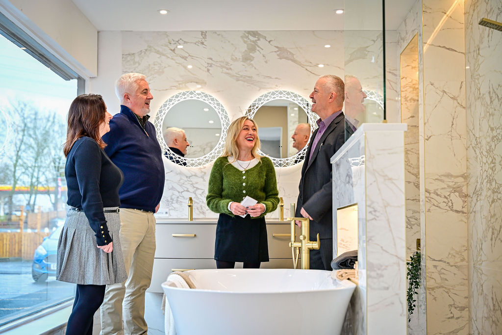 The Watertight Bathrooms design team with clients inside the Harrogate showroom